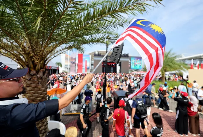 Fan waves Malaysian flag