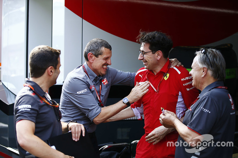 Guenther Steiner, Team Principal, Haas F1, is congratlated by a Gene Haas, Team Owner, Haas F1, and Mattia Binotto, Ferrari Chief Technical Officer