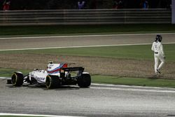 Lance Stroll, Williams FW40, climbs out of his car and walks away after a collision with Carlos Sainz Jr., Toro Rosso