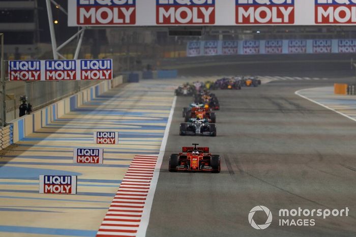 Sebastian Vettel, Ferrari SF90, leads Valtteri Bottas, Mercedes AMG W10, and Charles Leclerc, Ferrari SF90