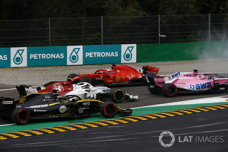 Sebastian Vettel, Ferrari SF71H lighting up his tyres after making contact with Lewis Hamilton, Mercedes AMG F1 W09 while Sergio Perez, Racing Point Force India VJM11,Charles Leclerc, Alfa Romeo Sauber C37 and Nico Hulkenberg, Renault Sport F1 Team R.S. 18 drive past