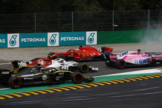 Sebastian Vettel, Ferrari SF71H lighting up his tyres after making contact with Lewis Hamilton, Mercedes AMG F1 W09 while Sergio Perez, Racing Point Force India VJM11,Charles Leclerc, Alfa Romeo Sauber C37 and Nico Hulkenberg, Renault Sport F1 Team R.S. 18 drive past