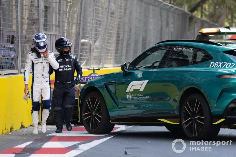 Franco Colapinto, Williams Racing, is lead to the medical car after a crash in FP1