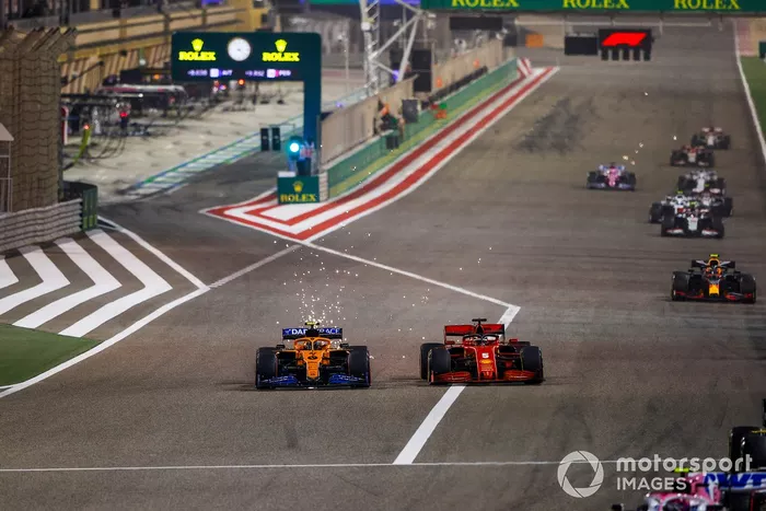 Lando Norris, McLaren MCL35, Sebastian Vettel, Ferrari SF1000