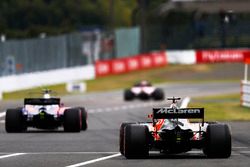 Fernando Alonso, McLaren MCL32, Pierre Gasly, Scuderia Toro Rosso STR12, leave the pits