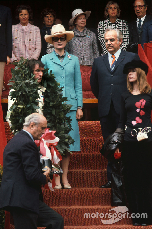 Podium: race winner Jackie Stewart, Tyrrell, with his wife Helen, Prince Albert and Princess Grace