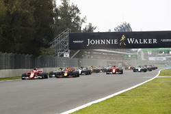 Sebastian Vettel, Ferrari SF70H, Max Verstappen, Red Bull Racing RB13, Lewis Hamilton, Mercedes AMG F1 W08, Valtteri Bottas, Mercedes AMG F1 W08, Kimi Raikkonen, Ferrari SF70H and the rest of the pack at the start