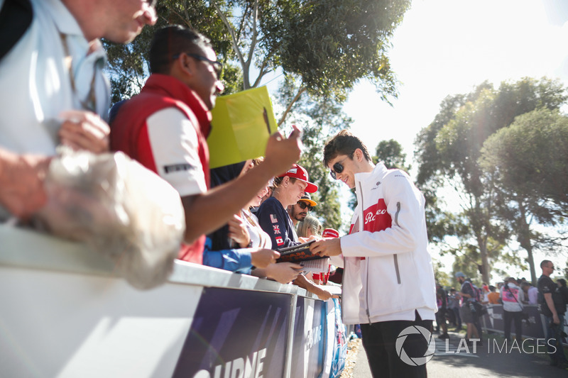 Charles Leclerc, Sauber, signs autographs for fans