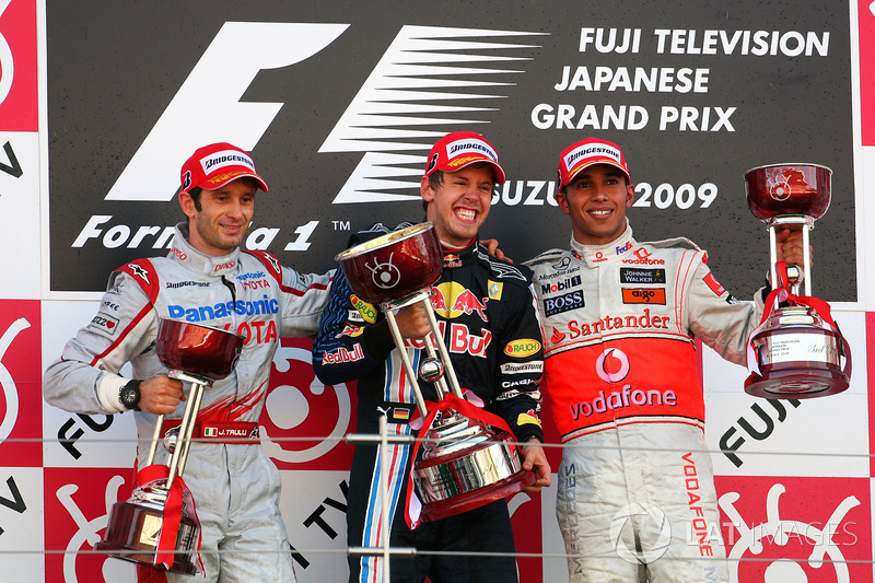 The podium: Jarno Trulli, Toyota, second; Sebastian Vettel, Red Bull Racing, race winner; Lewis Hami