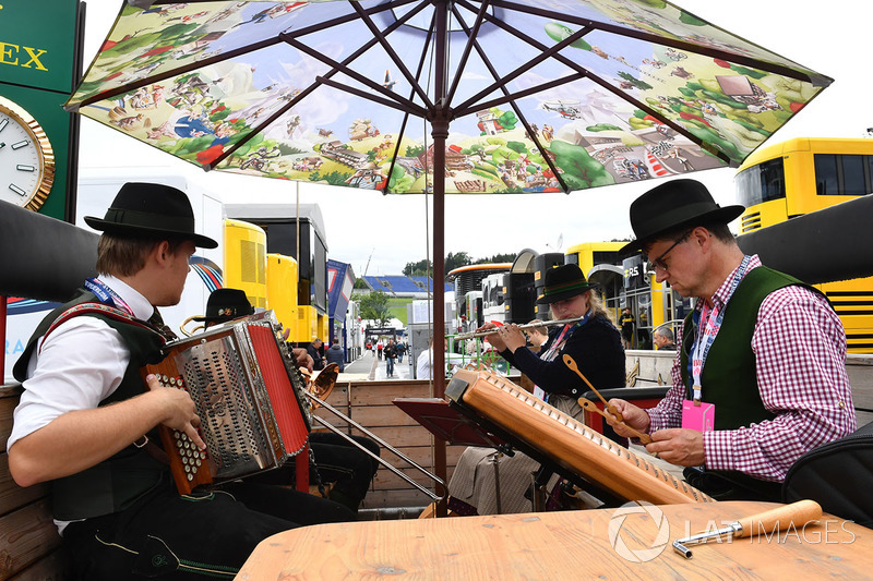 Musicians play in the paddock