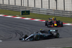 Valtteri Bottas, Mercedes AMG F1 W09, leads Max Verstappen, Red Bull Racing RB14 Tag Heuer