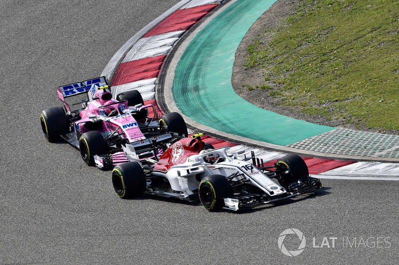 Charles Leclerc, Sauber C37 and Esteban Ocon, Force India VJM11