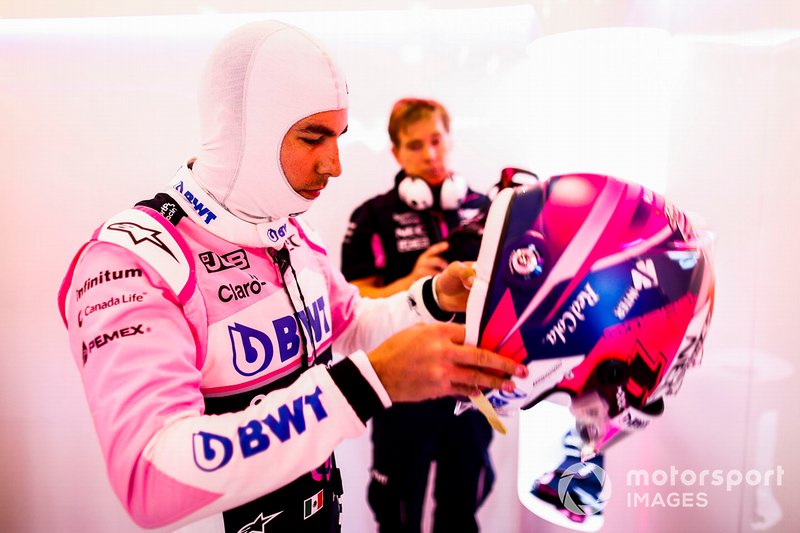 Sergio Perez, Racing Point, puts his helmet on