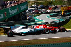 Sebastian Vettel, Ferrari SF70H, passes Valtteri Bottas, Mercedes AMG F1 W08, at the start