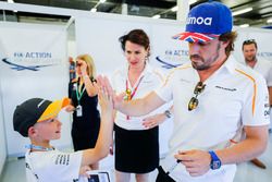 Fernando Alonso, McLaren, high fives a child