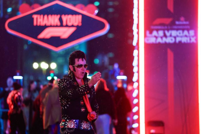 An Elvis impersonator in the Paddock during final practice 