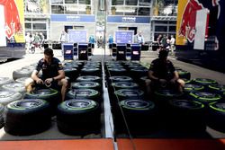 A Red Bull Racing mechanic with Pirelli tires