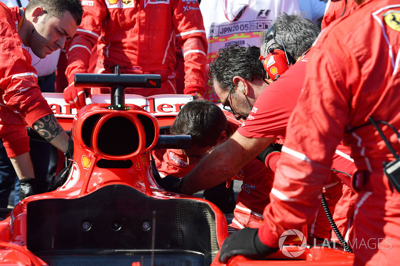 Ferrari mechanics work on the car of Sebastian Vettel, Ferrari SF70H