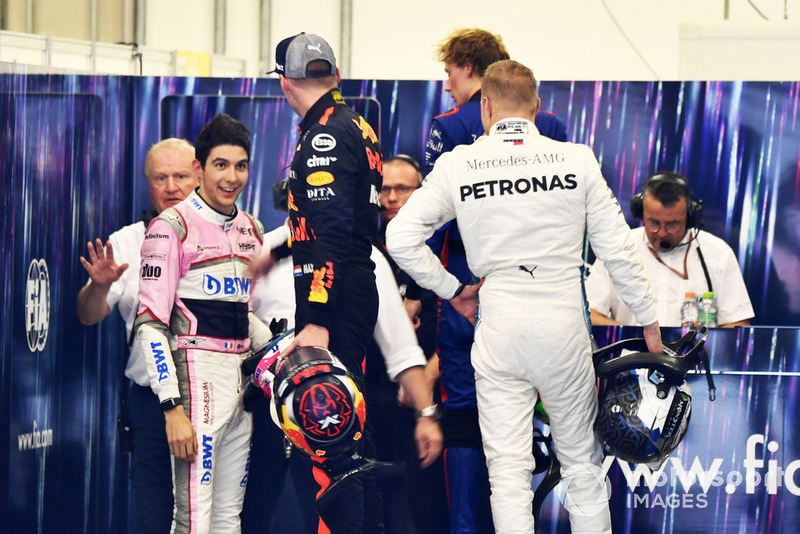 Max Verstappen, Red Bull Racing and Esteban Ocon, Racing Point Force India square up after the race following their on track crash 