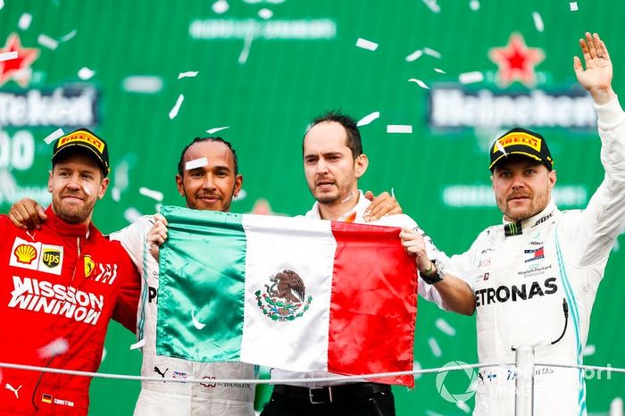 Sebastian Vettel, Ferrari, Race winner Lewis Hamilton, Mercedes AMG F1 and Valtteri Bottas, Mercedes AMG F1 celebrate on the podium 