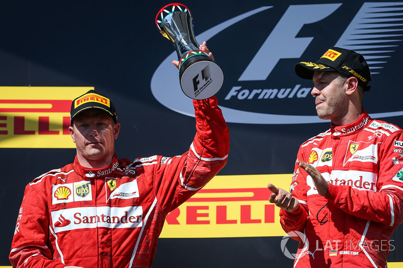 Подіум: переможець Себастьян Феттель, Кімі Райкконен, Ferrari