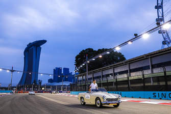 Stoffel Vandoorne, McLaren, rides in an MG Midget on the drivers' parade