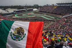 Fernando Alonso, McLaren MCL32 and fans in the grandstand with a Mexican flag