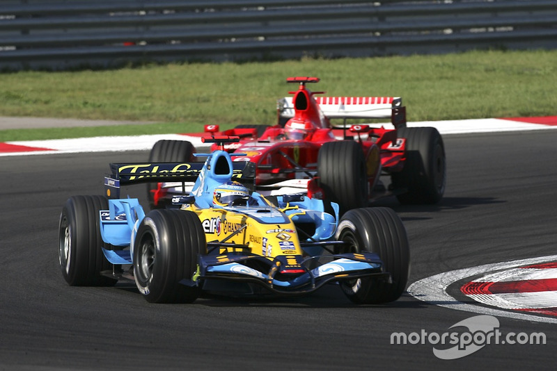 Fernando Alonso, Renault R26, leads Michael Schumacher, Ferrari 248 F1