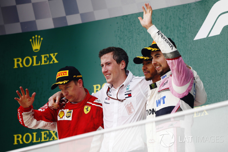 Kimi Raikkonen, Ferrari, 2nd position, the Mercedes Constructors trophy delegate, Lewis Hamilton, Mercedes AMG F1, 1st position, and Sergio Perez, Force India, 3rd position, on the podium