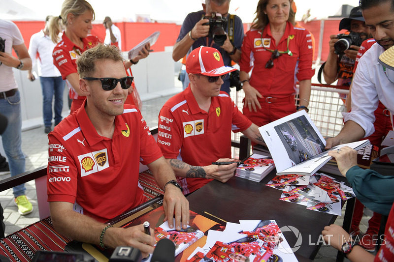 Sebastian Vettel, Ferrari and Kimi Raikkonen, Ferrari at the autograph session