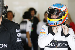 Fernando Alonso, McLaren MP4-31 adjusts his helmet in the garage