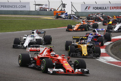 Kimi Raikkonen, Ferrari SF70H, leads Nico Hulkenberg, Renault Sport F1 Team RS17, Felipe Massa, Williams FW40, Daniil Kvyat, Scuderia Toro Rosso STR12