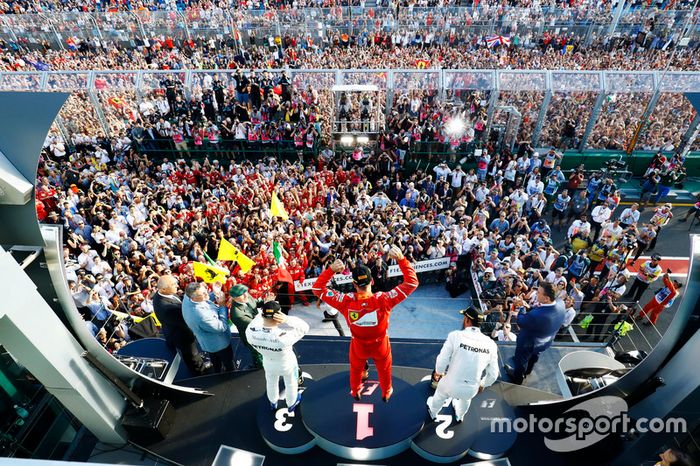 Sebastian Vettel, Ferrari, 1st Position, Lewis Hamilton, Mercedes AMG, 2nd Position, and Valtteri Bottas, Mercedes AMG, 3rd Position, celebrate on the podium