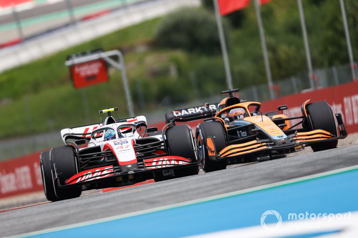 Daniel Ricciardo, McLaren MCL36, battles with Mick Schumacher, Haas VF-22