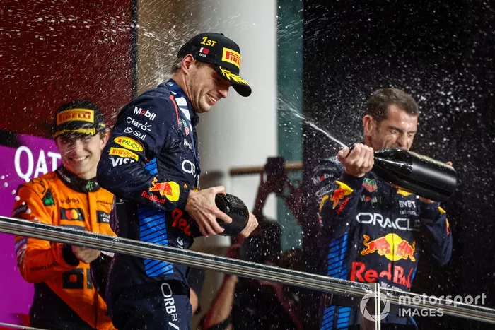 Max Verstappen, Red Bull Racing, 1st position, Oscar Piastri, McLaren F1 Team, 3rd position, the Red Bull Racing podium delegate spray champagne in celebration