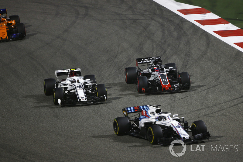 Lance Stroll, Williams FW41 Mercedes, leads Charles Leclerc, Sauber C37 Ferrari, Romain Grosjean, Haas F1 Team VF-18 Ferrari, and Stoffel Vandoorne, McLaren MCL33 Renault