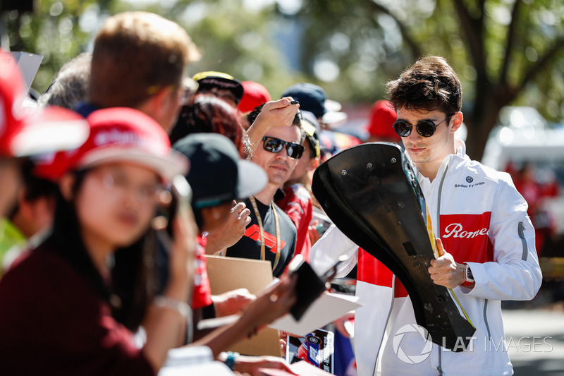 Charles Leclerc, Sauber, signs autographs for fans