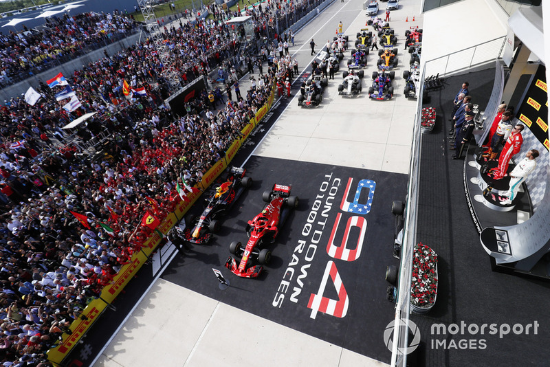 Kimi Raikkonen, Ferrari SF71H, celebrates on the podium with Max Verstappen, Red Bull Racing RB14, and Lewis Hamilton, Mercedes AMG F1 W09 EQ Power+