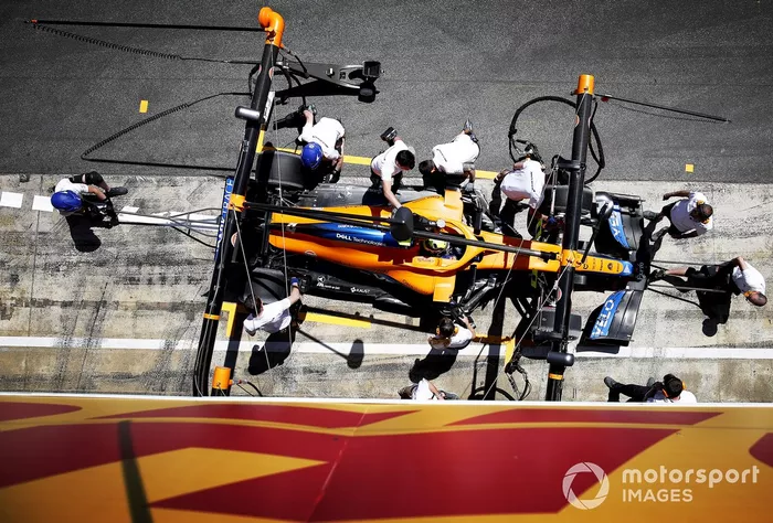 Lando Norris, McLaren MCL35M, makes a pit stop