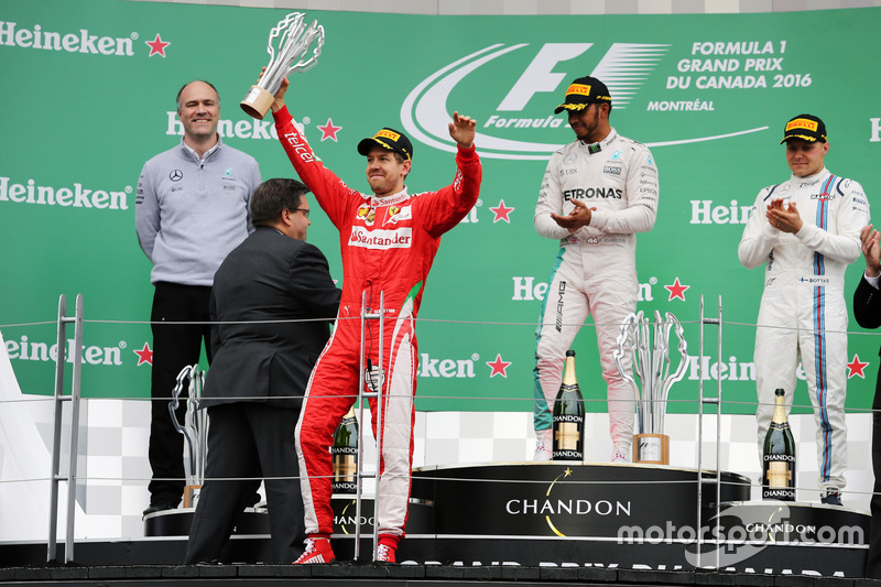 The podium (L to R): Sebastian Vettel, Ferrari, second; Lewis Hamilton, Mercedes AMG F1, race winner; Valtteri Bottas, Williams, third