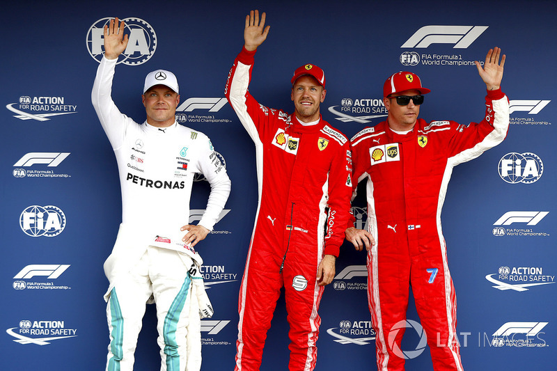 Pole sitter Sebastian Vettel, Ferrari, Valtteri Bottas, Mercedes AMG F1, Kimi Raikkonen, Ferrari