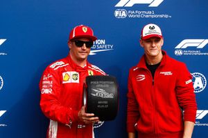 Mick Schumacher presents Kimi Raikkonen, Ferrari, with the Pirelli Pole Position award