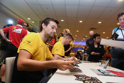 Jolyon Palmer, Renault Sport F1 Team and Nico Hulkenberg, Renault Sport F1 Team sign autographs for the fans