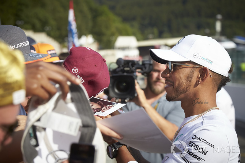 Lewis Hamilton, Mercedes AMG F1, signs autographs for fans