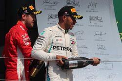 Sebastian Vettel, Ferrari and Lewis Hamilton, Mercedes AMG F1 on the podium