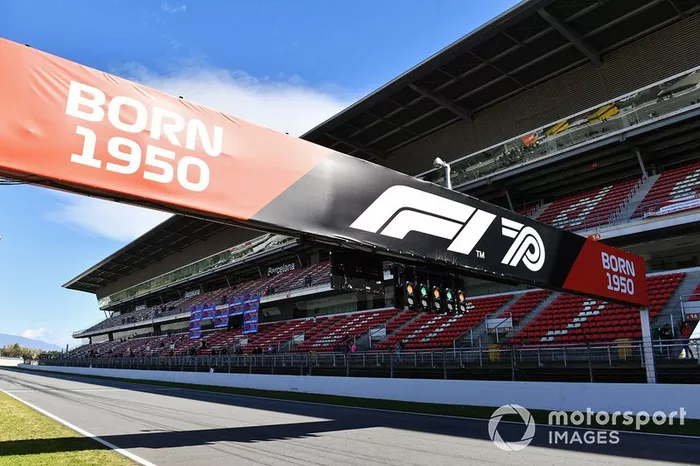 The message Born in 1950 over a bridge on the pit straight