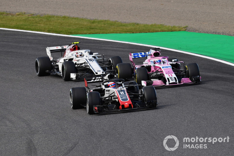 Romain Grosjean, Haas F1 Team VF-18, Sergio Perez, Racing Point Force India VJM11 and Charles Leclerc, Sauber C37 battle