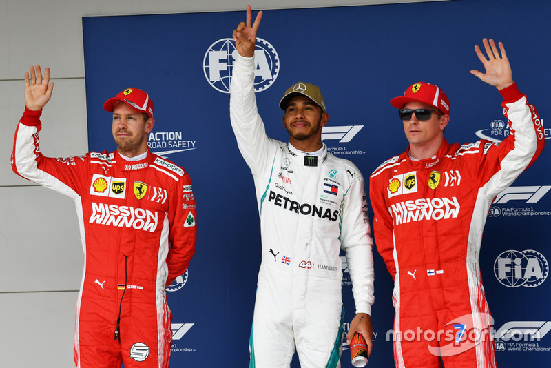 Polesitter Lewis Hamilton, Mercedes AMG F1, second place Sebastian Vettel, Ferrari, third place Kimi Raikkonen, Ferrari,