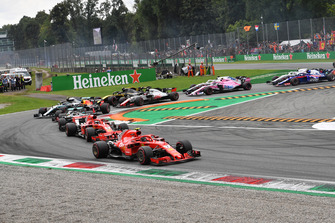 Kimi Raikkonen, Ferrari SF71H, Sebastian Vettel, Ferrari SF71H and Lewis Hamilton, Mercedes AMG F1 W09 at the start of the race