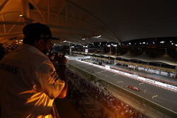 A fan watches Kimi Raikkonen, Ferrari SF70H, from the grandstand